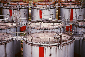 pattern of old large oil storage tanks