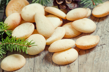 Christmas round gingerbread cookies, cones and spruce branches o