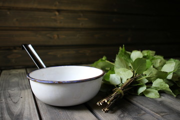 Sauna interior. Traditional sauna from Finland. Equipment and birch whisk. Whisk is used for body...