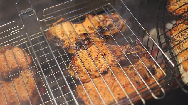 Meat on the grill with flames closeup