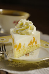 cake with cream and tangerines
