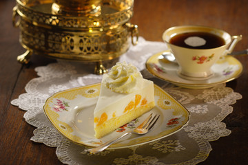 cake with cream and tangerines