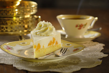 cake with cream and tangerines