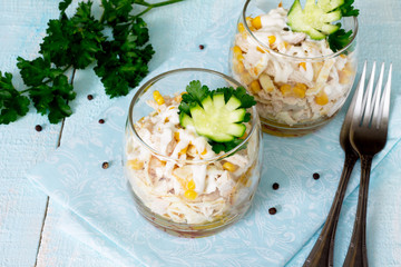 Salad with Egg rolls, chicken, corn and cucumber