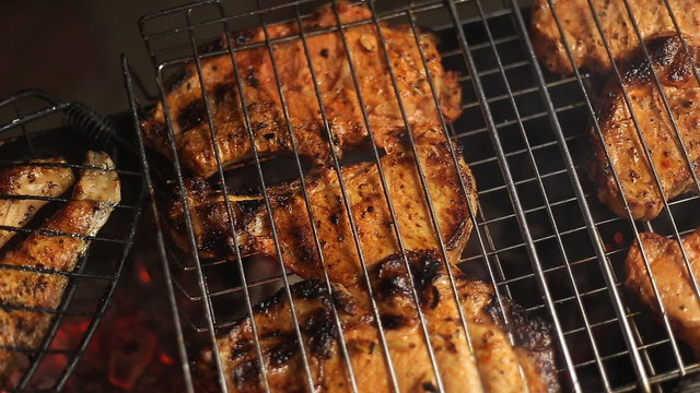 Meat on the grill with flames closeup