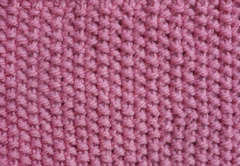 Moss stitch knitting in pink wool