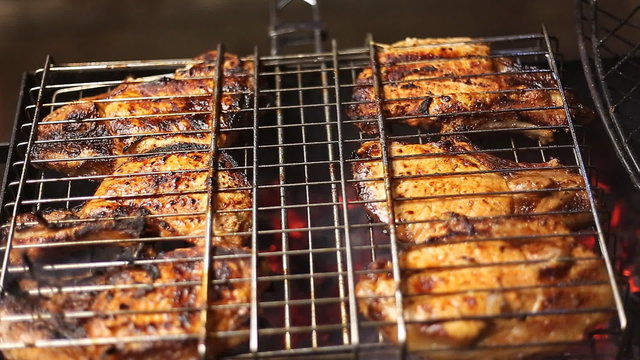 Meat on the grill with flames closeup