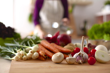 Young Woman Cooking in the kitchen. Healthy Food