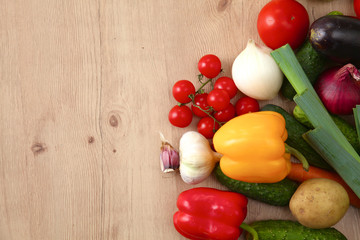 Pile of organic vegetables on a wooden table