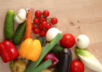 Pile of organic vegetables on a wooden table