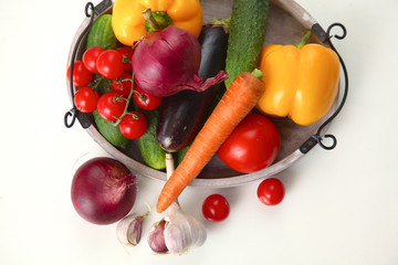 Fresh autumn vegetables on a white background