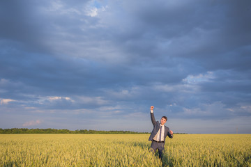 young business man think look up hold tablet pc computer