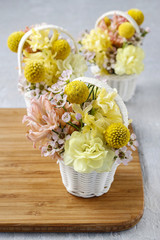 Steps of making floral decorations with early spring flowers: hy