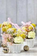 Steps of making floral decorations with early spring flowers: hy