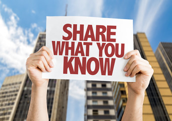 Share What You Know placard with cityscape background