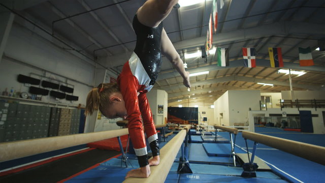 WS Girl (12-13) performing gymnastics on balance beam / Lindon, Utah, USA.