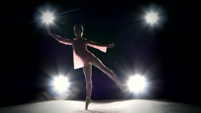 Young ballerina girl dancer in studio