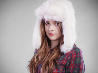 Young woman in winter clothing fur cap