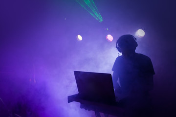 Music Dj mixing at nightclub