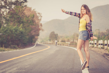 Trendy Hipster Girl  Relaxing on the road at the day time.