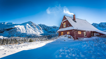 Fototapeta premium Warm accommodation in a mountain cottage in winter