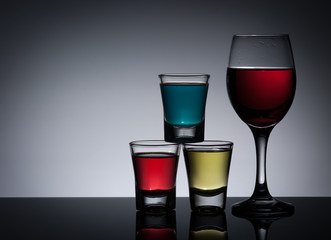 Exotic bottle alcohol cocktail and glass ,dark background