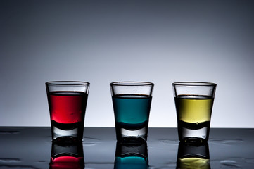 Exotic bottle alcohol cocktail and glass ,dark background