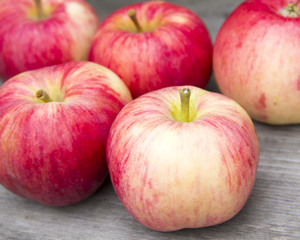 Red apples on a wooden