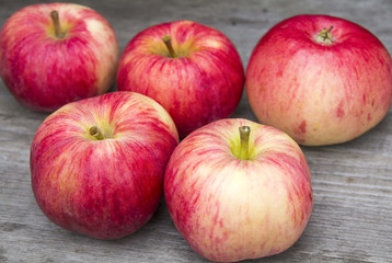 Red apples on a wooden