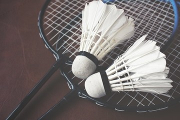 Shuttlecocks with badminton racket.