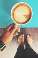 Selfie of coffee with feet at home