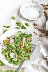 Lambs lettuce salad with walnuts and radish