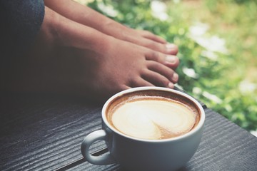 Coffee with feet in the garden