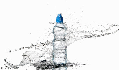 Water. Small plastic water bottle with water drops and splash on