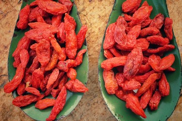 Dried goji berries on vintage spoon