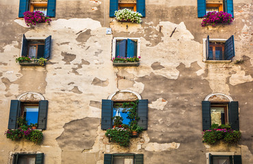 Window in an old house decorated with flower