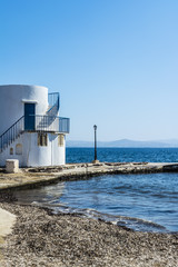 View of traditional fishing village of Empoureio at Milos island in Greece
