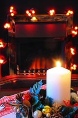 Christmas candle and fireplace.