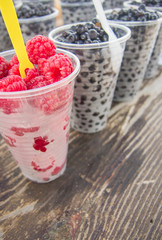 ripe fresh raspberry and huckleberry forest fruits