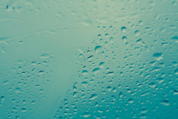 Natural water drops on glass