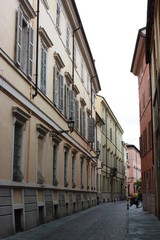 Fototapeta na wymiar narrow beautiful alley in in Parma Italy