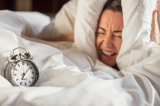 Woman can't listen to that alarm clock