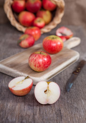 Autumn crops: red apples on a dark wooden table
