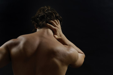 muscular man with back pain