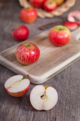 Autumn crops: red apples on a dark wooden table