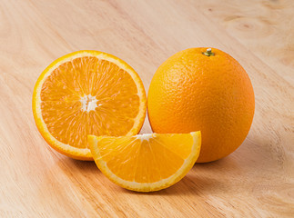 Fresh oranges on wooden background