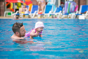 family swimming in the pool
