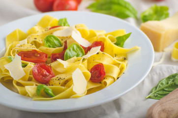 Tagliatelle in Italian colors, roasted tomatoes, basil Tagliatelle