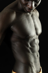 Obraz na płótnie Canvas A black man with a muscular body