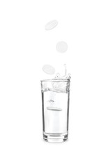 medical tablet falling into glass